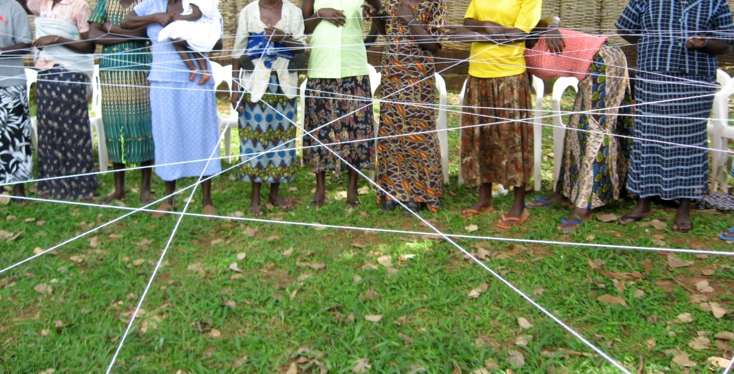 Formerly-abducted women during the ‘web of unity’ exercise at a Gender Justice theatre workshop