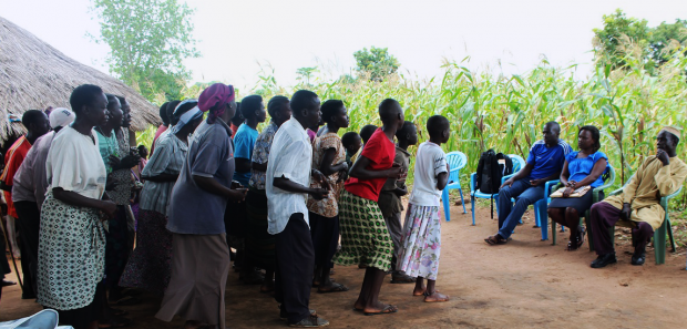 Members of Limo Can Tek victims' group in Pupwonya parish, Atiak rehearse for the Bearing Witness post-participation event on 16 October 2014. The event will be held at Atiak sub-county headquarters and will feature song, dance and theatre to highlight post-conflict transition challenges and solutions identified during the project.