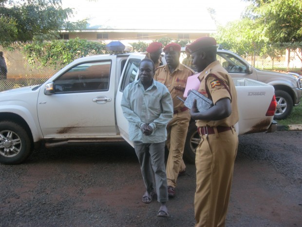 Kwoyelo with Wardens